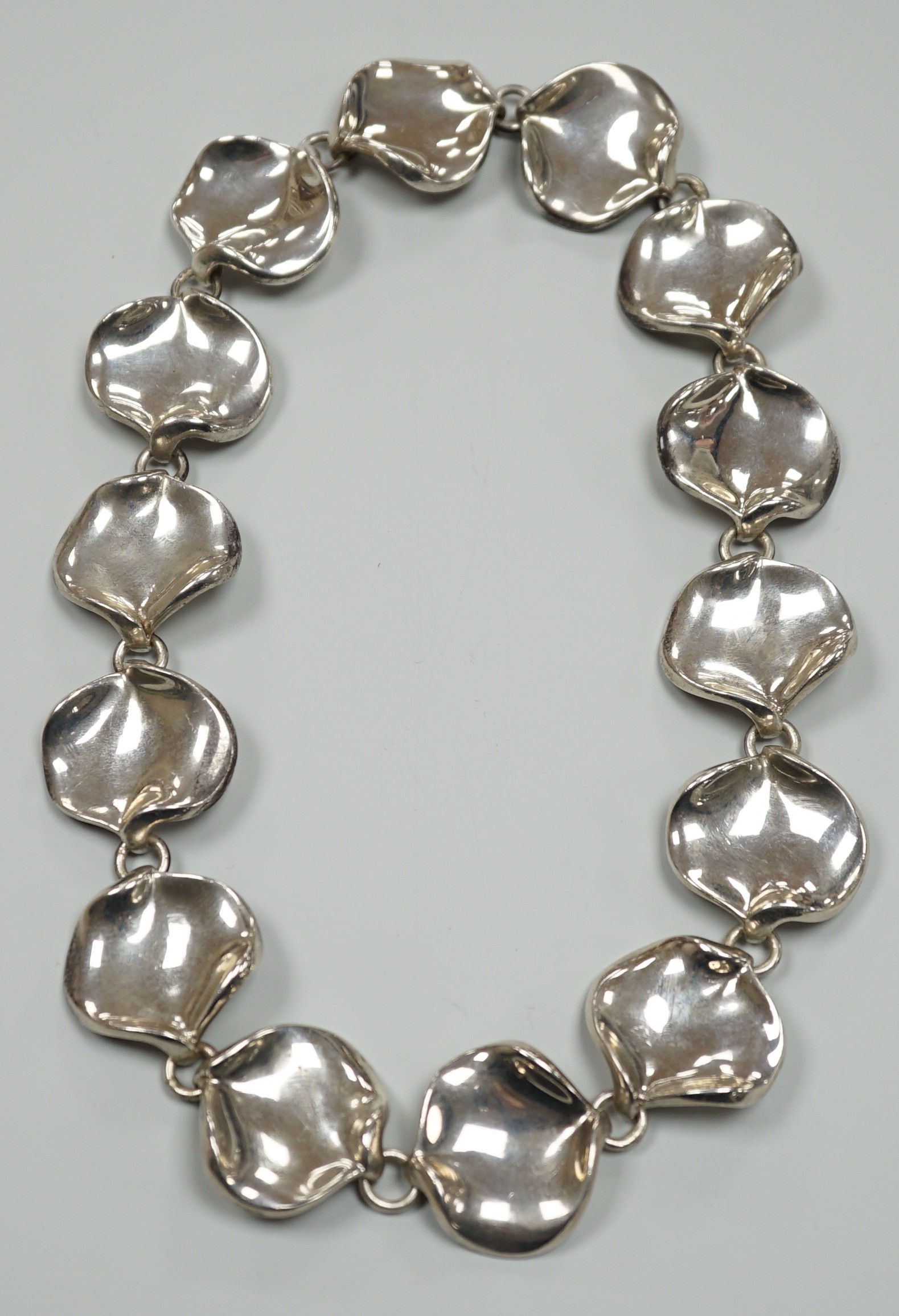 A modern Georg Jensen style silver necklace, with stylised petal links, maker AoL, London, 2008, 44cm, 189 grams.